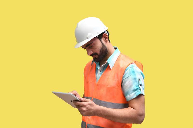 Close-up of a technician inspecting a commercial boiler system